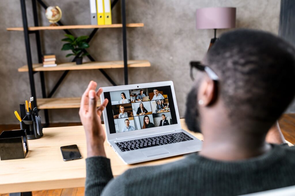 A remote worker meets with his colleagues via online video, but has often wondered about independent contractor misclassification.