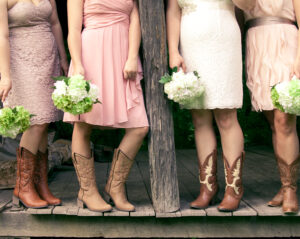 waist down view of bridesmaids and brides in cowboy boots learning how to change your last name in texas