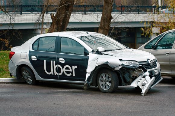 Uber car after an accident in a parking lot