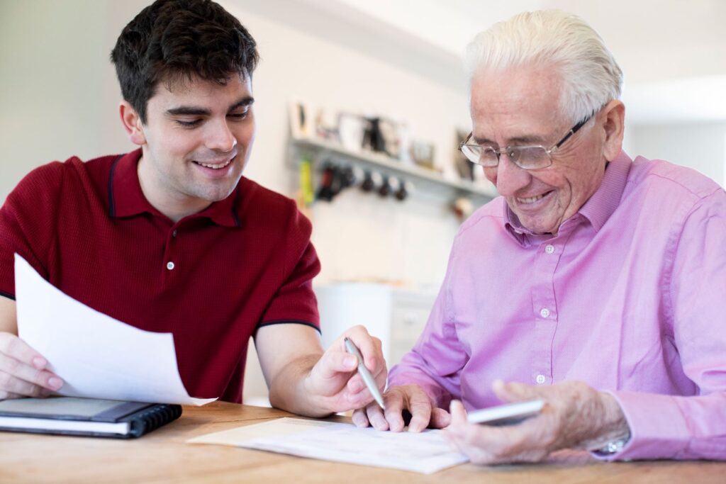 A young man is showing his grandfather how to revoke a power of attorney.
